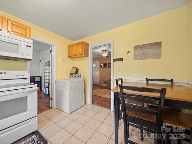 427 E 12th Ave, Gastonia, NC 28054 - kitchen featuring white appliances, washer / dryer, light tile patterned flooring, and a ceiling fan