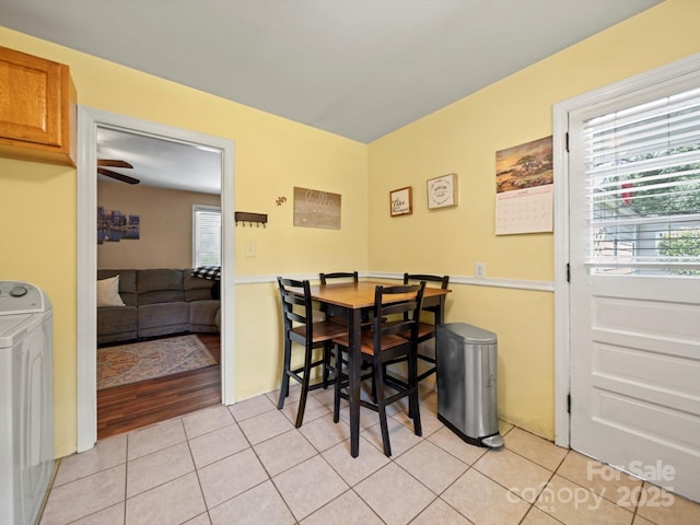 427 E 12th Ave, Gastonia, NC 28054 - dining room featuring washer / clothes dryer, light tile patterned flooring, and plenty of natural light