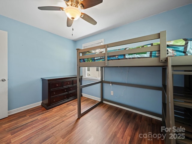 427 E 12th Ave, Gastonia, NC 28054 - bedroom featuring wood finished floors and baseboards