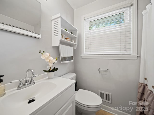 427 E 12th Ave, Gastonia, NC 28054 - bathroom featuring toilet and vanity