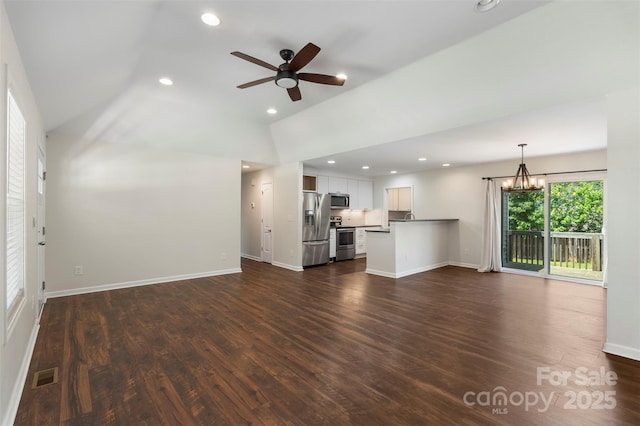 7627 Sarah Dr, Denver, NC 28037 - unfurnished living room with vaulted ceiling, a chandelier, dark wood-type flooring, recessed lighting, and a ceiling fan