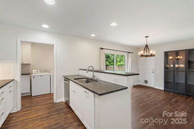 7627 Sarah Dr, Denver, NC 28037 - kitchen with washing machine and clothes dryer, dark wood-type flooring, decorative backsplash, white cabinets, and recessed lighting