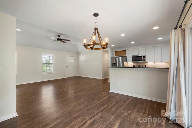 7627 Sarah Dr, Denver, NC 28037 - kitchen featuring appliances with stainless steel finishes, a chandelier, dark countertops, recessed lighting, and dark wood-style floors