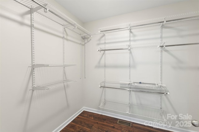 7627 Sarah Dr, Denver, NC 28037 - walk in closet with wood finished floors