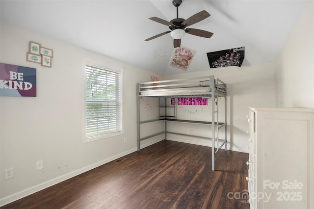 7627 Sarah Dr, Denver, NC 28037 - unfurnished bedroom featuring vaulted ceiling, wood finished floors, and ceiling fan