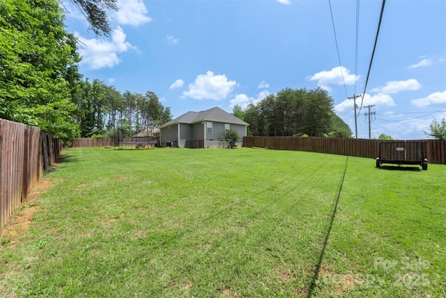 7627 Sarah Dr, Denver, NC 28037 - fenced backyard with a trampoline