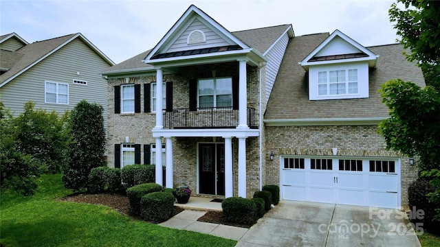 408 Presidio Dr, Rock Hill, SC 29732 - view of front of property with a balcony, brick siding, driveway, and a standing seam roof