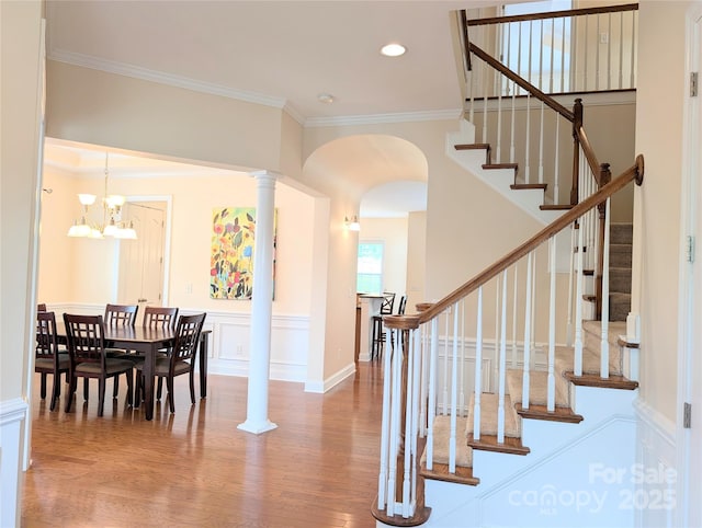 408 Presidio Dr, Rock Hill, SC 29732 - foyer entrance featuring wood finished floors, crown molding, stairs, arched walkways, and recessed lighting