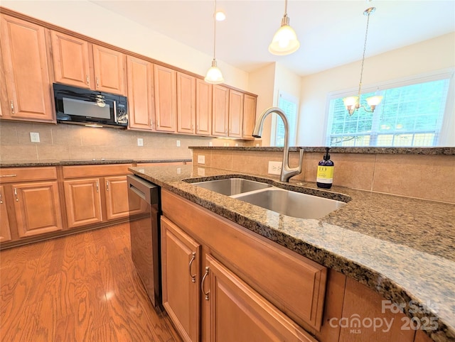 408 Presidio Dr, Rock Hill, SC 29732 - kitchen featuring black microwave, dishwashing machine, light wood-type flooring, tasteful backsplash, and hanging light fixtures