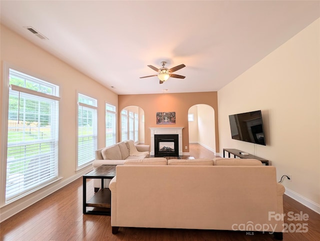 408 Presidio Dr, Rock Hill, SC 29732 - living area featuring arched walkways, a ceiling fan, a fireplace, and dark wood finished floors