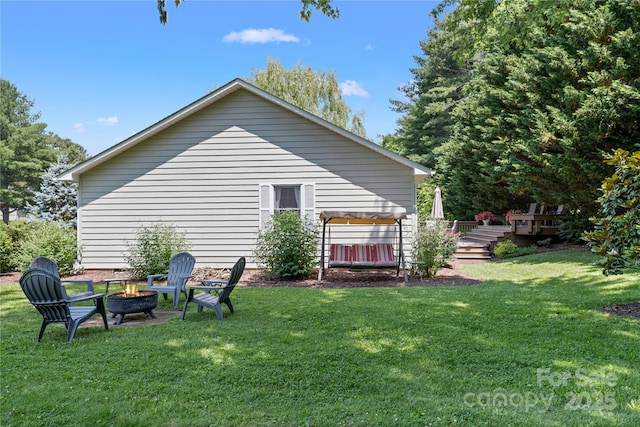 4 Orchard Pl, Weaverville, NC 28787 - rear view of house featuring a fire pit, a wooden deck, and a yard