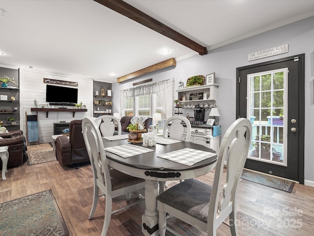142 Hickory Rd, Lexington, NC 27292 - dining area with wood finished floors, a fireplace, healthy amount of natural light, recessed lighting, and crown molding