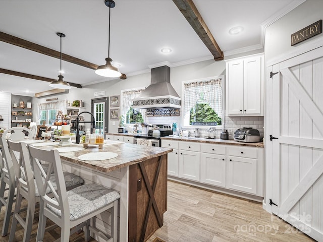 142 Hickory Rd, Lexington, NC 27292 - kitchen with island range hood, stainless steel electric range, beamed ceiling, tasteful backsplash, and white cabinetry