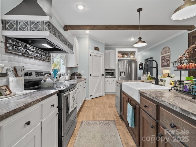 142 Hickory Rd, Lexington, NC 27292 - kitchen featuring appliances with stainless steel finishes, crown molding, beam ceiling, white cabinets, and tasteful backsplash