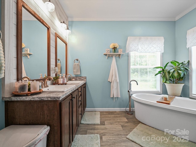 142 Hickory Rd, Lexington, NC 27292 - bathroom with double vanity, wood finished floors, a freestanding tub, and crown molding