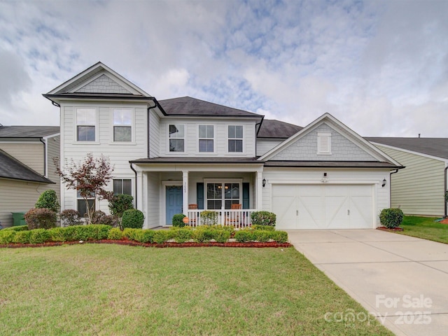 3009 Palm Dr, Fort Mill, SC 29715 - view of front facade featuring a porch, a garage, a front yard, and concrete driveway