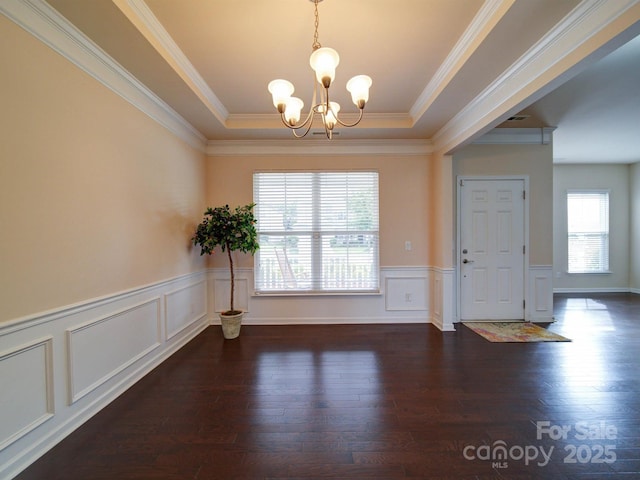 3009 Palm Dr, Fort Mill, SC 29715 - unfurnished dining area with a chandelier, wood finished floors, a wainscoted wall, crown molding, and a tray ceiling