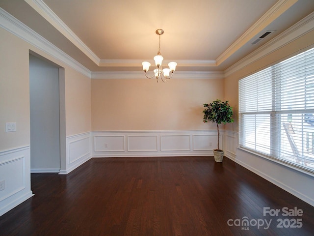 3009 Palm Dr, Fort Mill, SC 29715 - unfurnished room with a chandelier, dark wood finished floors, wainscoting, ornamental molding, and a decorative wall