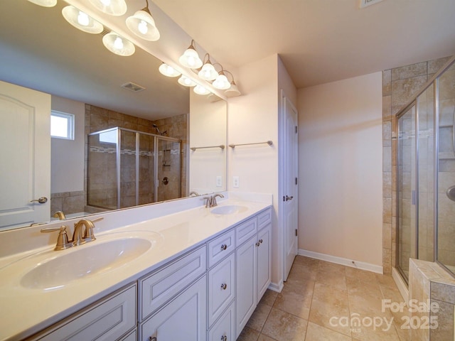 3009 Palm Dr, Fort Mill, SC 29715 - bathroom with a shower stall, double vanity, and tile patterned flooring