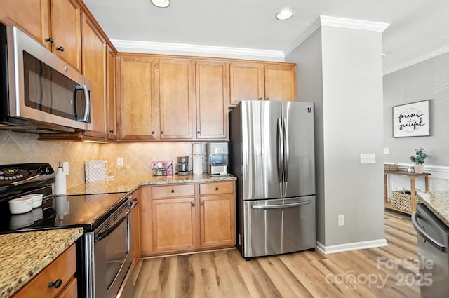 529 River Park Rd, Belmont, NC 28012 - kitchen with appliances with stainless steel finishes, light wood-type flooring, crown molding, tasteful backsplash, and light stone countertops