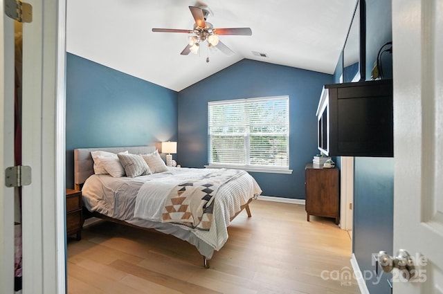 529 River Park Rd, Belmont, NC 28012 - bedroom with light wood-style flooring, vaulted ceiling, and a ceiling fan