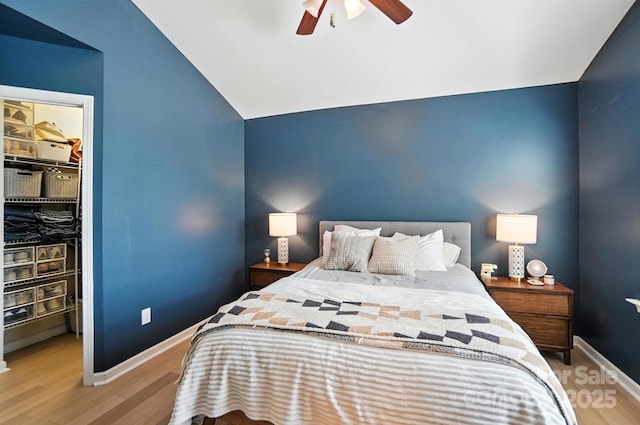 529 River Park Rd, Belmont, NC 28012 - bedroom with vaulted ceiling, a spacious closet, wood finished floors, a closet, and ceiling fan