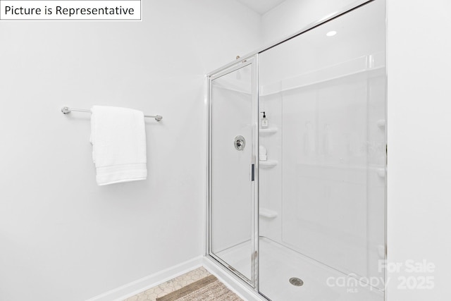 1357 Secrest Commons Dr, Monroe, NC 28112 - bathroom with a stall shower and baseboards