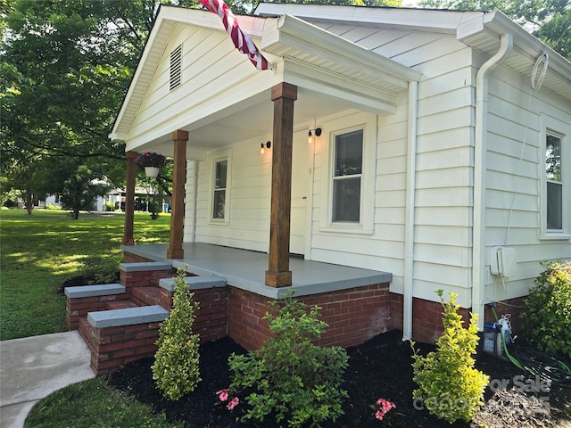 616 Laurel St, Albemarle, NC 28001 - view of side of home featuring covered porch and a lawn