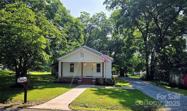 616 Laurel St, Albemarle, NC 28001 - bungalow featuring a porch and a front lawn