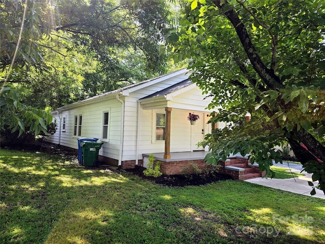 616 Laurel St, Albemarle, NC 28001 - view of home's exterior featuring a porch and a yard