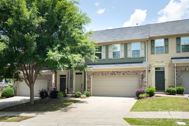 3537 Hornets Nest Way Unit 206, Charlotte, NC 28208 - view of front of home featuring brick siding, concrete driveway, and an attached garage