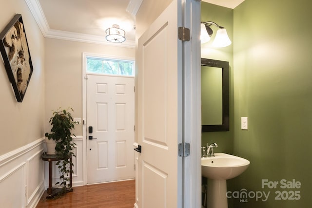3537 Hornets Nest Way Unit 206, Charlotte, NC 28208 - bathroom featuring crown molding, wood finished floors, and a wainscoted wall