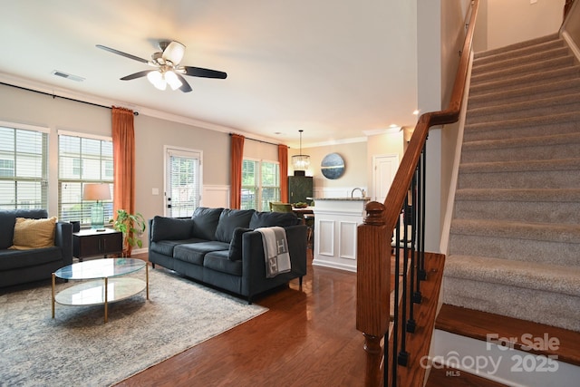 3537 Hornets Nest Way Unit 206, Charlotte, NC 28208 - living room with dark wood-style flooring, crown molding, stairs, and a ceiling fan