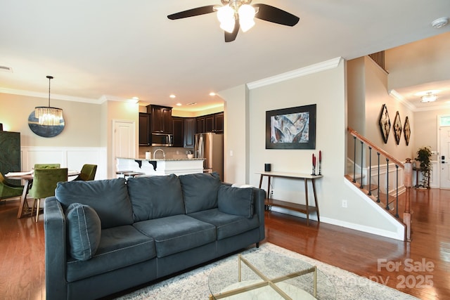 3537 Hornets Nest Way Unit 206, Charlotte, NC 28208 - living area with ornamental molding, wood finished floors, ceiling fan, stairs, and recessed lighting