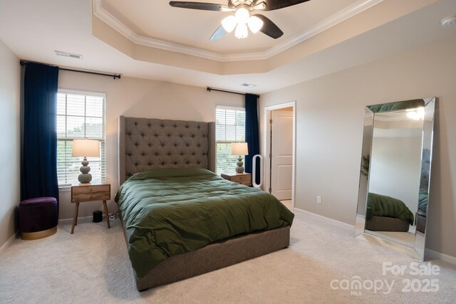 3537 Hornets Nest Way Unit 206, Charlotte, NC 28208 - carpeted bedroom with a tray ceiling, ornamental molding, and a ceiling fan