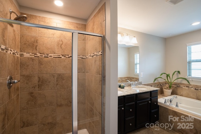 3537 Hornets Nest Way Unit 206, Charlotte, NC 28208 - full bath featuring double vanity, a shower stall, a garden tub, and recessed lighting
