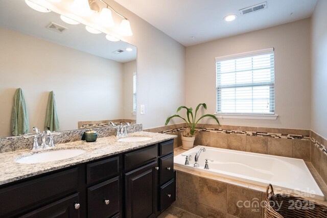 3537 Hornets Nest Way Unit 206, Charlotte, NC 28208 - full bathroom with double vanity, plenty of natural light, and a bath