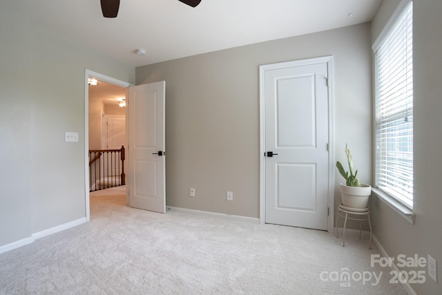 3537 Hornets Nest Way Unit 206, Charlotte, NC 28208 - unfurnished bedroom featuring carpet floors and ceiling fan