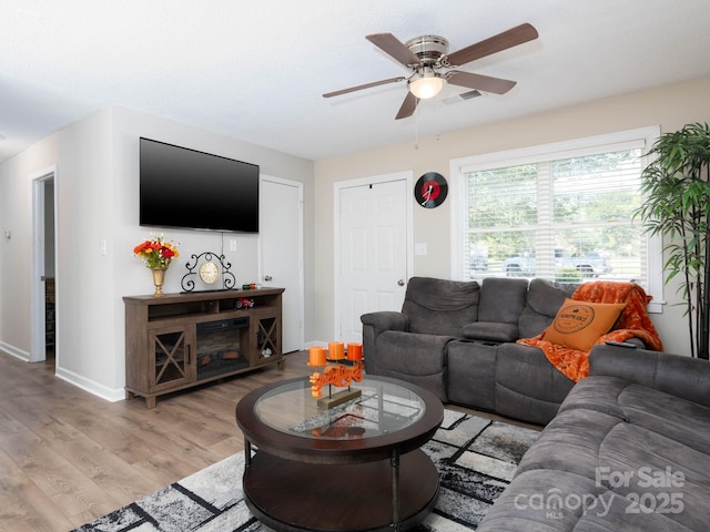 327 Downing St, Troutman, NC 28166 - living area featuring ceiling fan and light wood finished floors