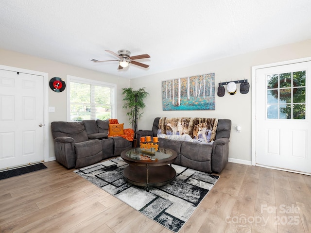 327 Downing St, Troutman, NC 28166 - living room with wood finished floors and a ceiling fan