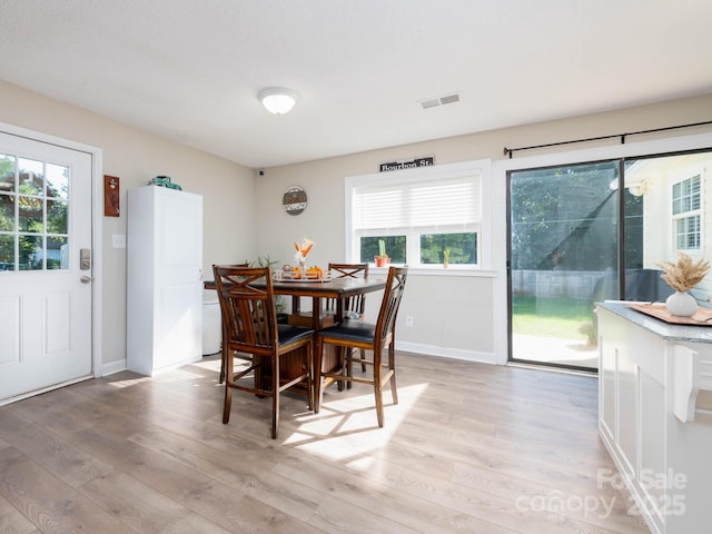 327 Downing St, Troutman, NC 28166 - dining area featuring light wood-style flooring and healthy amount of natural light