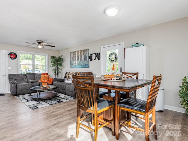 327 Downing St, Troutman, NC 28166 - dining room featuring ceiling fan and light wood-type flooring