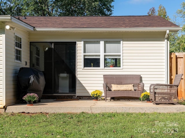 327 Downing St, Troutman, NC 28166 - back of property featuring a patio and a shingled roof