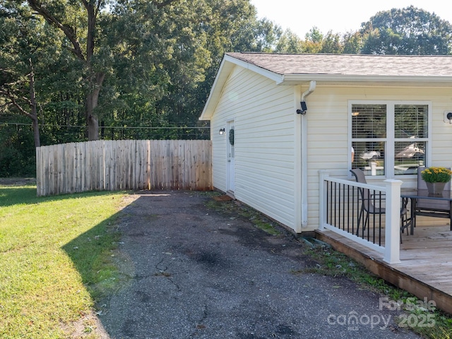 327 Downing St, Troutman, NC 28166 - view of side of property with roof with shingles and a wooden deck