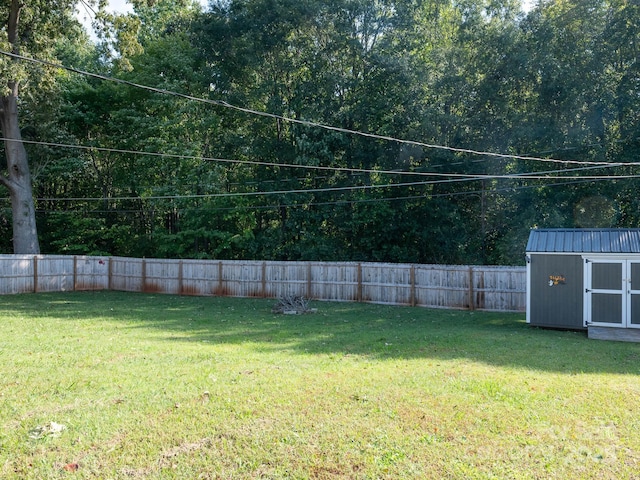 327 Downing St, Troutman, NC 28166 - fenced backyard with a storage unit