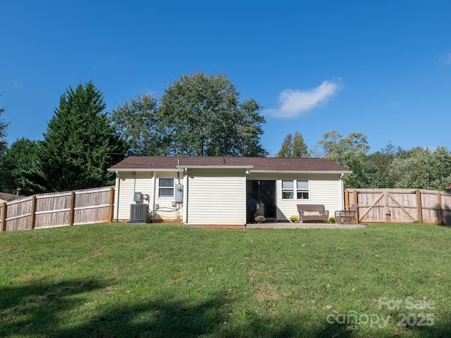 327 Downing St, Troutman, NC 28166 - back of property featuring a fenced backyard and a gate