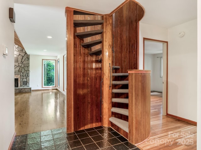 3310 Windbluff Dr, Charlotte, NC 28277 - stairs with wood finished floors and a stone fireplace
