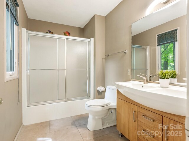 3310 Windbluff Dr, Charlotte, NC 28277 - bathroom with vanity, tile patterned floors, and enclosed tub / shower combo