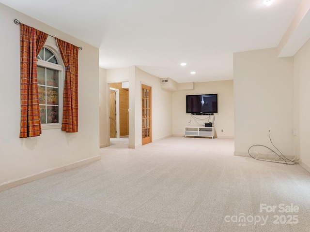 3310 Windbluff Dr, Charlotte, NC 28277 - unfurnished living room with carpet flooring and recessed lighting