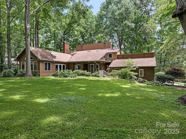 3310 Windbluff Dr, Charlotte, NC 28277 - back of house with a chimney and a yard